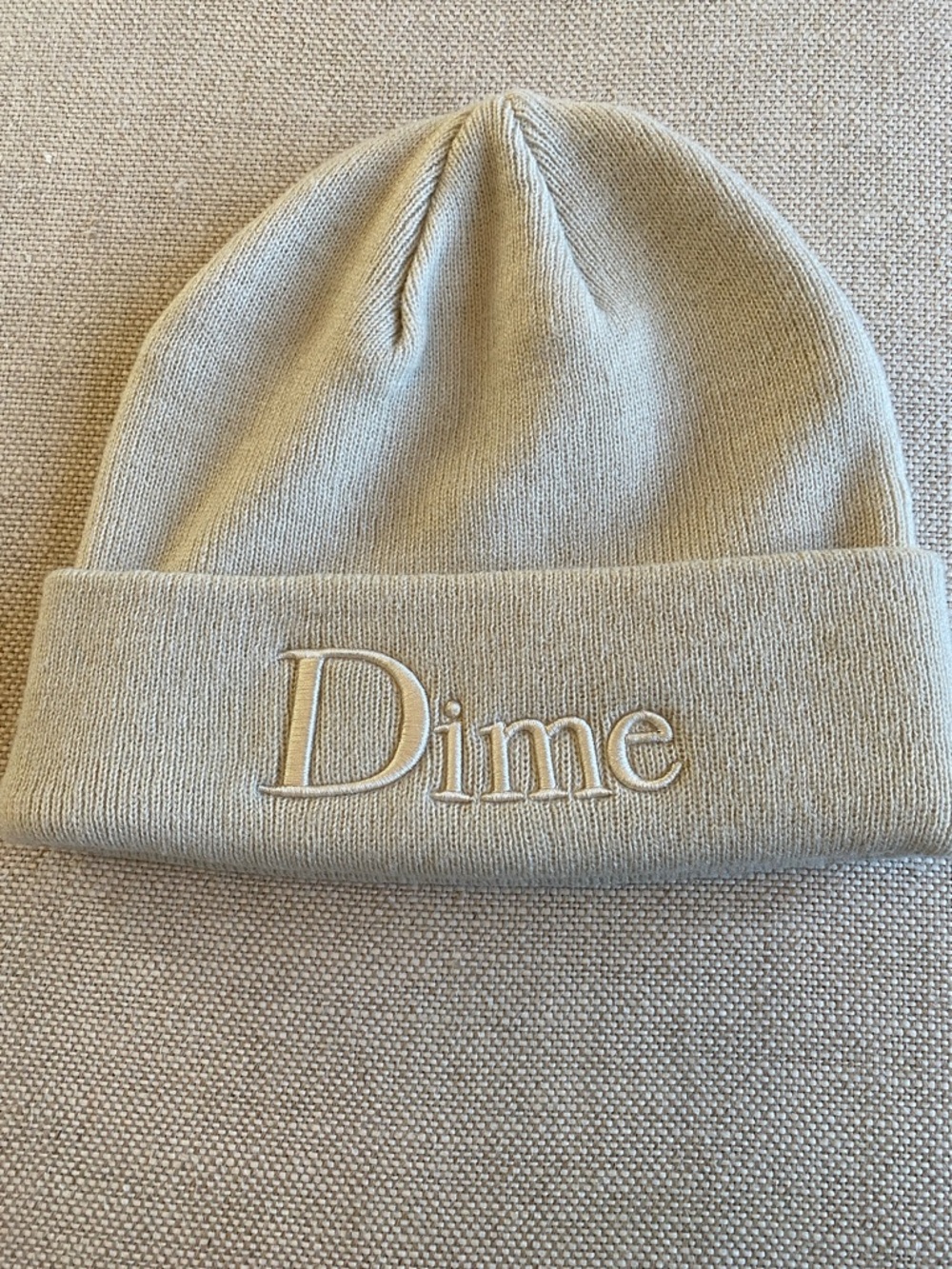 Dime Embroidered Cuffed Beanie in Beige